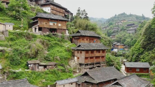 Aerial view of traditional wooden building cluster of Xijiang Qianhu Miao Village (The One Thousand Household Miao Village) , in southeastern Guizhou province of China.