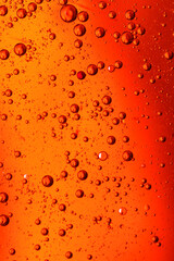 oil bubbles with water on glass