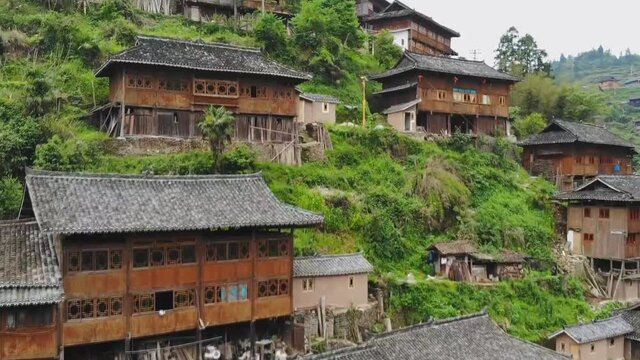 Aerial view of traditional wooden building cluster of Xijiang Qianhu Miao Village (The One Thousand Household Miao Village) , in southeastern Guizhou province of China.