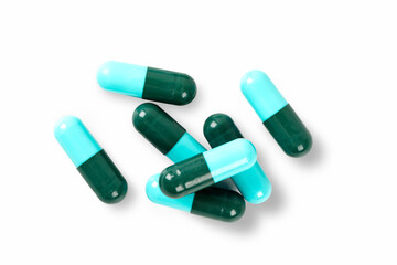 Close up green and blue capsule on white background. Top view
