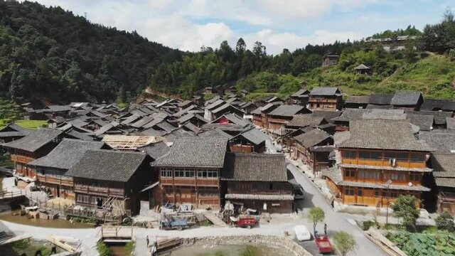 Aerial view of traditional wooden building cluster of Xijiang Qianhu Miao Village (The One Thousand Household Miao Village) , in southeastern Guizhou province of China.
