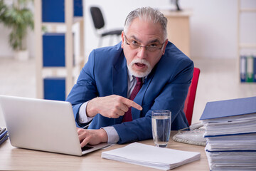 Old male employee and too much work in the office