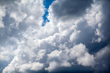 Dramatic sky with grey clouds over the city before the storm. Weather before or after a storm.