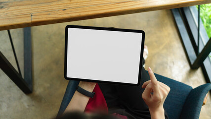 Top view, woman holding digital tablet, tablet blank screen