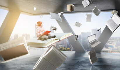 Little girl reading a book
