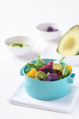 Fresh fruit and vegetable salad with avocado, dragon fruit, pumpkin, radish, lettuce and corn salad. Concepts of healthy food, vegetarian and lifestyle trends.