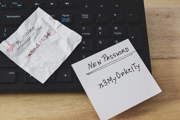 A person's choice of new password containing alphanumeric characters laid on computer keyboard on...
