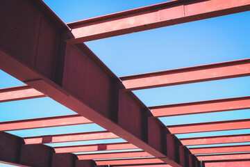 Steel Structure Beam Girder of Building at Construction Site, Metal I-Beam Erection Detail and Coat Painting Rust Resistant Under Construction. Steelwork Structural Engineering Design Assembly Work