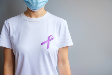 Hand holding purple Ribbon for Pancreatic, Esophageal, Testicular cancer, world Alzheimer,...