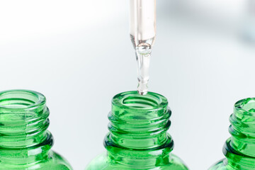 Dropper glass bottles with pipette. Transparent hyaluronic natural beauty product and eco serum skin care concept. Top horizontal view copyspace.