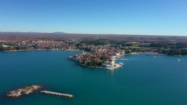 Panorama Of Porec Town At Daytime With Calm Blue Sea At Daytime In Istria Peninsula, Croatia. - aerial