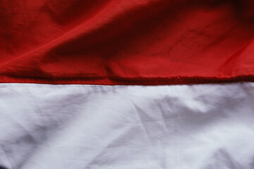 The wavy, red, and white flag of the Republic of Indonesia.
