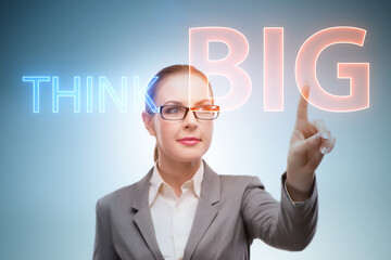 Think big concept with businesswoman