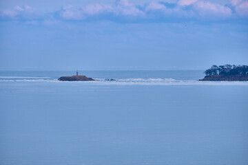 Vanino, Russia - Jan 18, 2021: Vanino Bay in the Tatar Strait in winter. The frozen sea.