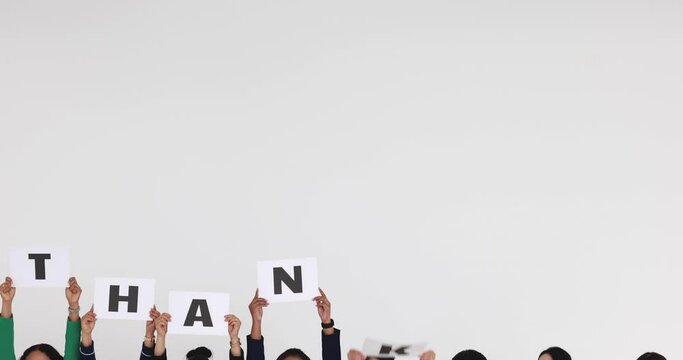 Group of people join together and hold separate thank you letters and rise over heads for sign of appreciate to something or someone on white background with copy space.