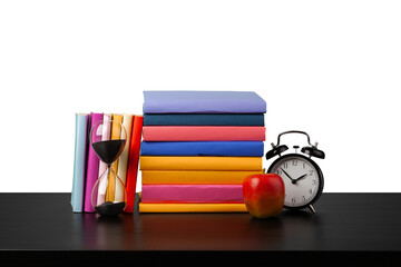 Stack of books and alarm clock, time to read concept