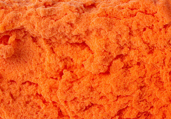Bright orange abstract surface or pattern as background or backdrop.