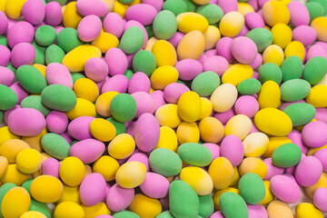 Group of colorful peanuts in glaze.