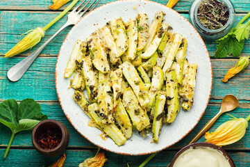Roasted zucchini sticks with greens