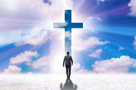 Religious concept with cross and lonely man
