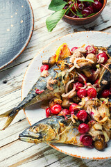 Grilled mackerel fish stuffed with cherries