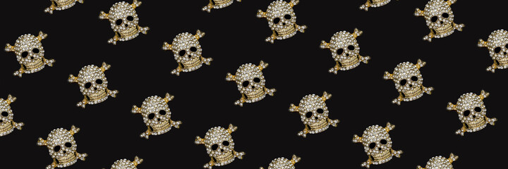 Banner with halloween pattern. Golden skull with rhinestones on black background. Happy hallowen holiday concept