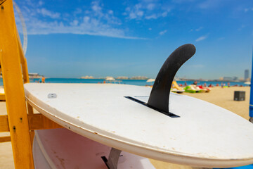 Obraz na płótnie Canvas Surfboards stacked on the rack on a beach