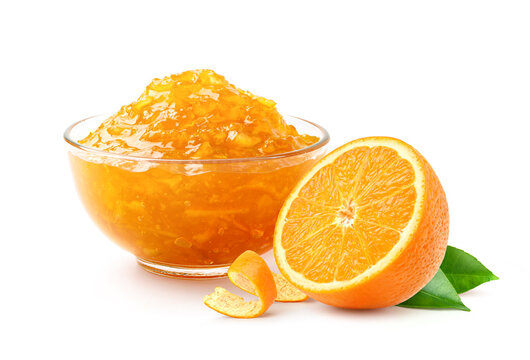 Orange marmalade with cut in half isolated on white background.