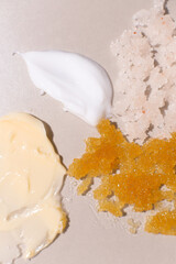 Body scrub of oatmeal, sugar, honey and oil in melat eco jar on white table, homemade cosmetic for peeling and spa care. texture view