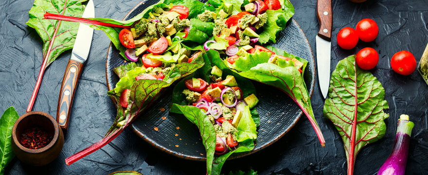 Spring vegetable salad in chard leaves