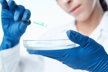 woman with blue gloves laboratory research science