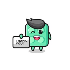 the mascot of the brick toy holding a banner that says thank you
