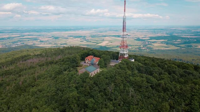 Drone flight over mountain village with forests. Sleza mountain near Wroclaw in Poland. Nature background, aerial view
