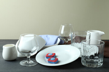 Concept of Dishwashing detergent accessories on dark wooden table
