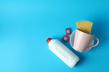 Concept of Dishwashing detergent accessories on blue background