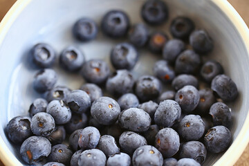 blueberries in a plate on the table background