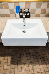 Top view of chrome faucet washbasin. Interior of bathroom with sink basin faucet.