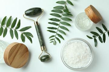 Skin care concept with face roller on white background © Atlas