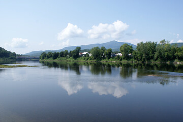 Obraz premium Reflection on the Connecticut River in Windsor Vt.