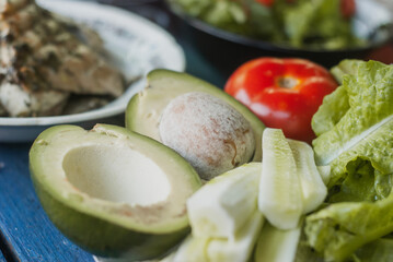 Vegetables on top. Fish, avocado, cucumbers, lettuce. The Mediterranean diet