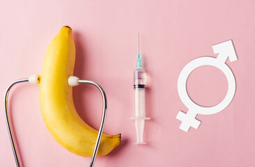 World sexual health or Aids day, Top view flat lay condom in wrapper pack, syringe, Male, female gender signs and doctor stethoscope on a pink background, Safe sex and reproductive health concept