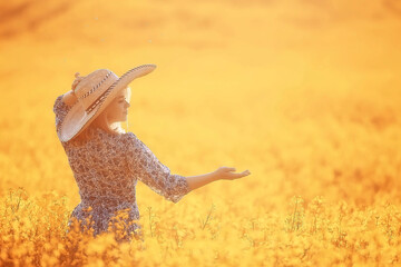 attractive active beautiful female, freedom happy view from the back, in a field of flowers