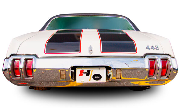 Classical American vintage car Oldsmobile 442 1970. Back view. White background.