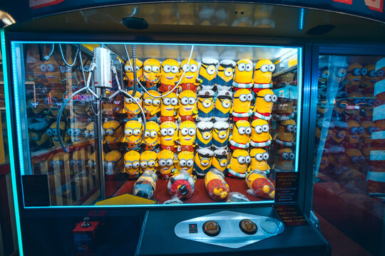26 February 2021, UAE, Dubai: Coin operated claw machine which allows you to win a soft minion toy or lose money