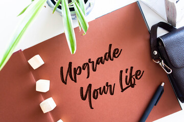 Upgrade Your Life, the phrase is written on multi-colored stickers, on a blue background. Business...
