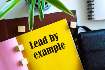 Text lead by example on the short note texture background
