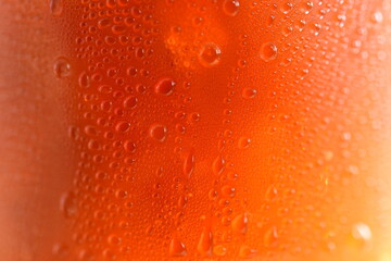 Black drop of orange-yellow water droplets