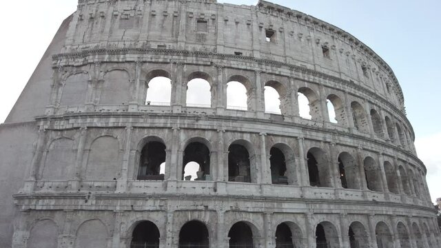 Majestic with ancient Roman architectural facade biggest amphitheater Flavius or Colosseum in Rome downtown