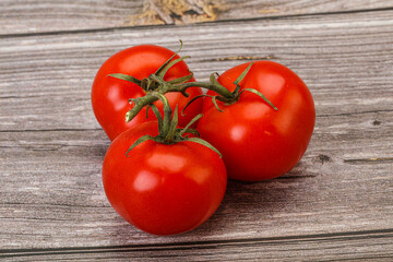 Red bright ripe tomato branch