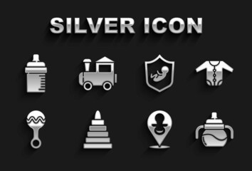 Set Pyramid toy, Baby clothes, bottle, dummy pacifier, Rattle baby, on shield, and Toy train icon. Vector